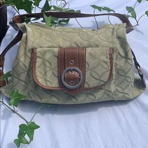 Green purse with leather strap and front pocket